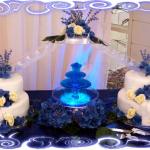 Unique fountain set up using silk flowers serving 85 also used fondant icing