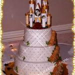 Buttercream icing with a trellis effect and gold dragees .  The is a castle topper decorated by the bride and placed on top of my cake, stairways  around the sides are all cake. 